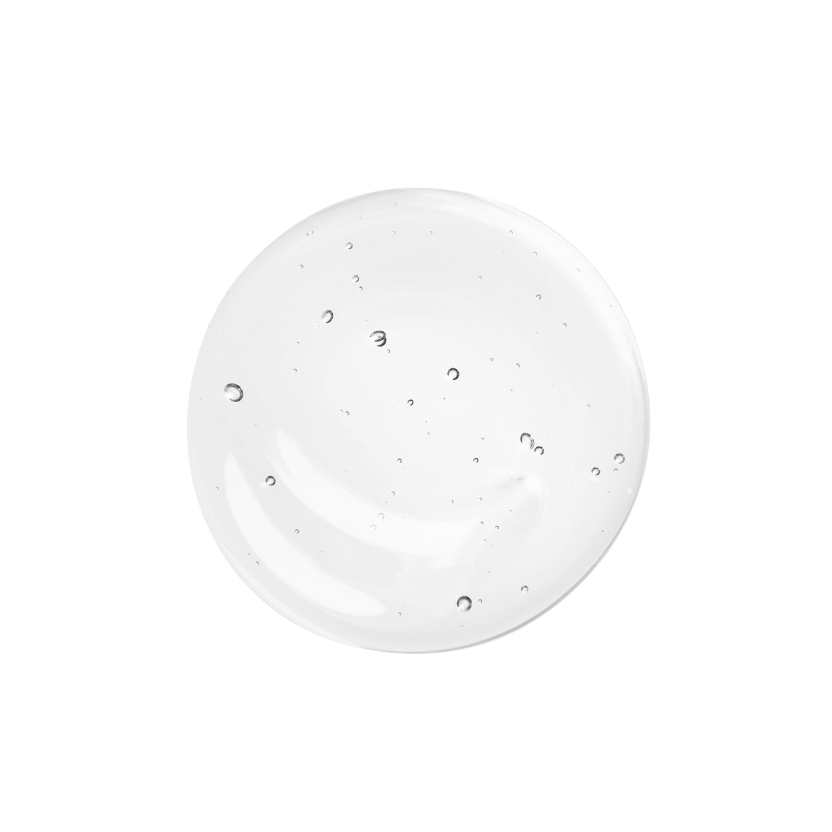 Texture gel translucide et fluide du Ricigel en goutte sur fond blanc, soin des cils L'Atelier du Sourcil Paris
